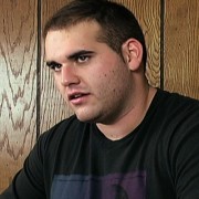 Young man with close-cropped dark hair